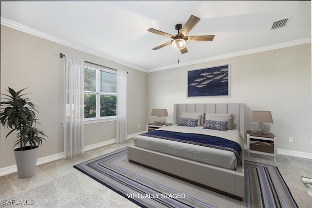 carpeted bedroom featuring visible vents, baseboards, and ornamental molding