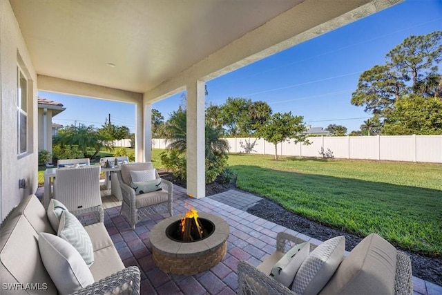 view of patio featuring an outdoor living space with a fire pit and a fenced backyard