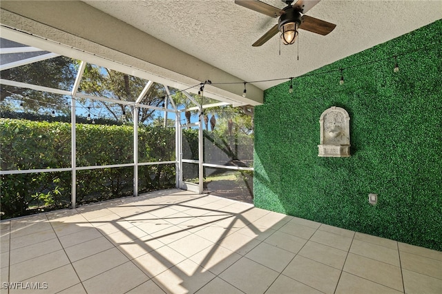 view of patio / terrace featuring a lanai and a ceiling fan