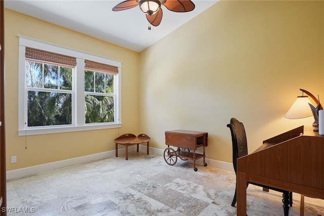 office featuring vaulted ceiling, baseboards, and ceiling fan