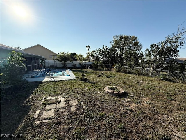 view of yard with a fenced backyard and a fenced in pool