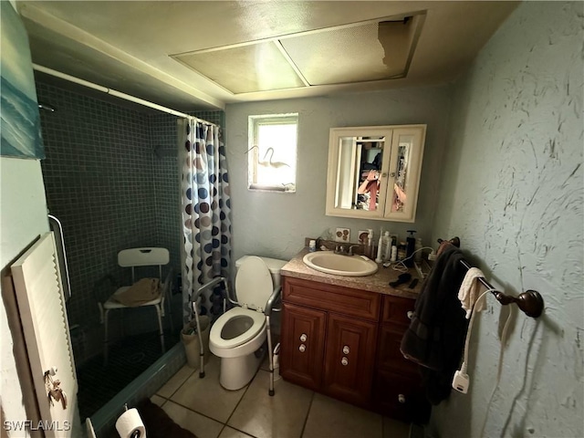 full bathroom featuring toilet, tiled shower, a textured wall, tile patterned floors, and vanity