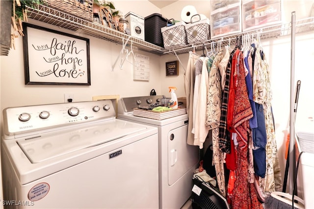 laundry room featuring independent washer and dryer and laundry area