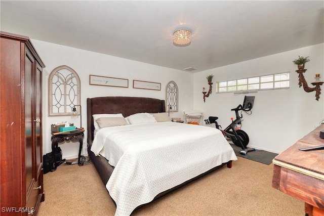 bedroom featuring light colored carpet