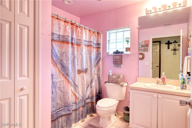 bathroom with tile patterned floors, toilet, and vanity