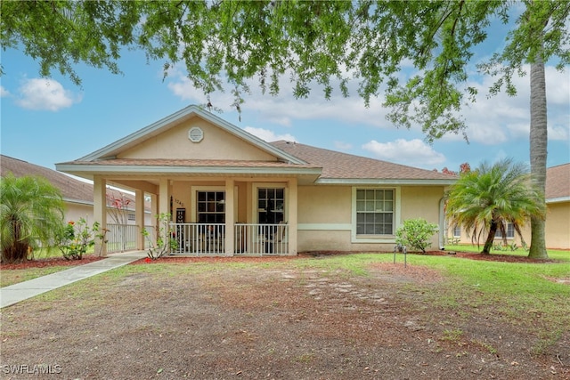 view of front of house featuring stucco siding and a porch