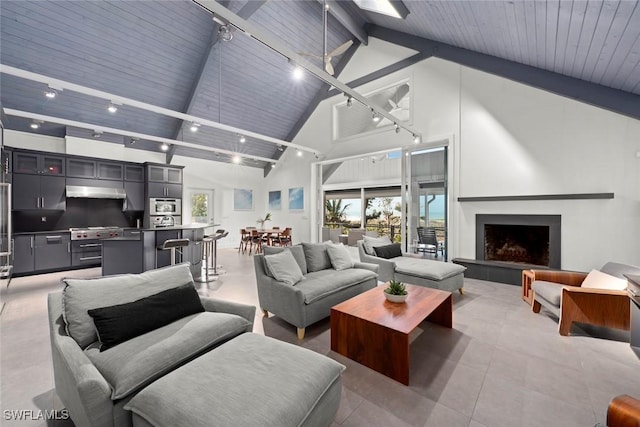 16886 Captiva Dr, Captiva, FL 33924 - living area with a wealth of natural light, high vaulted ceiling, wooden ceiling, and beam ceiling