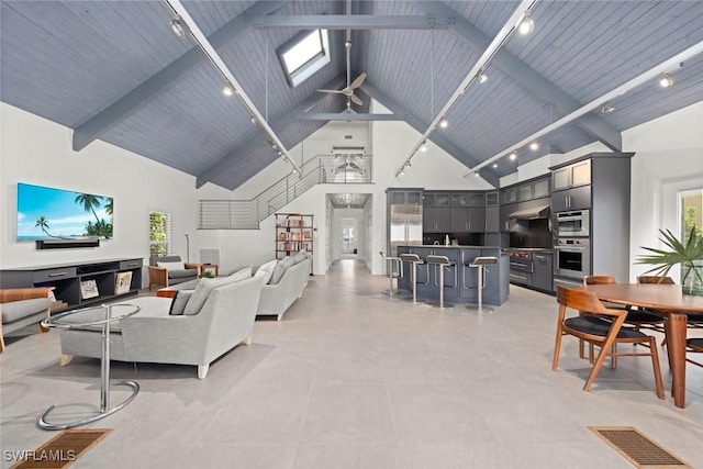 16886 Captiva Dr, Captiva, FL 33924 - living area featuring high vaulted ceiling, beam ceiling, ceiling fan, visible vents, and track lighting