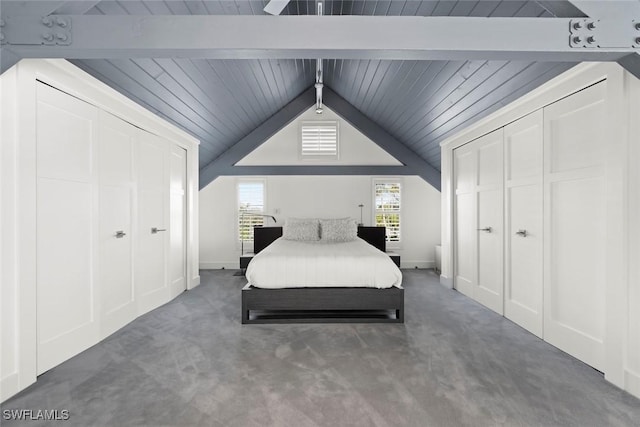 16886 Captiva Dr, Captiva, FL 33924 - carpeted bedroom featuring lofted ceiling with beams and a closet