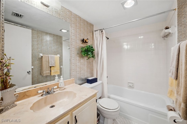 full bath featuring vanity, shower / bath combo with shower curtain, toilet, and visible vents