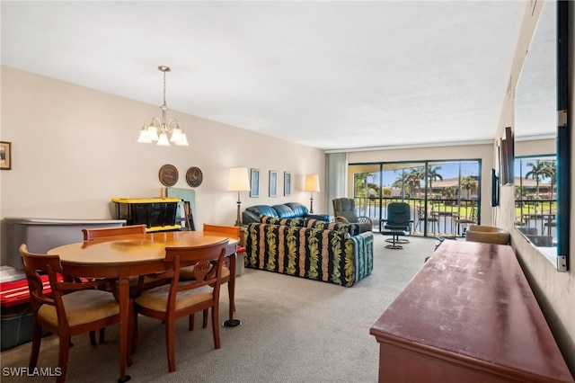 carpeted dining space with an inviting chandelier