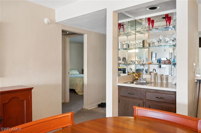 bar featuring wet bar and a sink