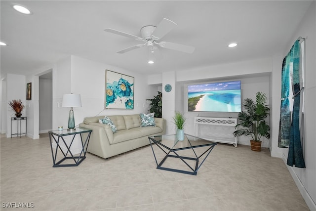 living area with light tile patterned floors, recessed lighting, baseboards, and ceiling fan