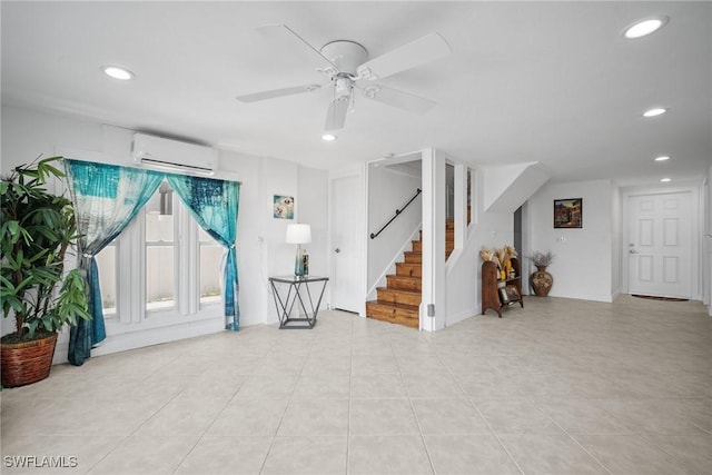 interior space with an AC wall unit, recessed lighting, light tile patterned floors, ceiling fan, and stairs