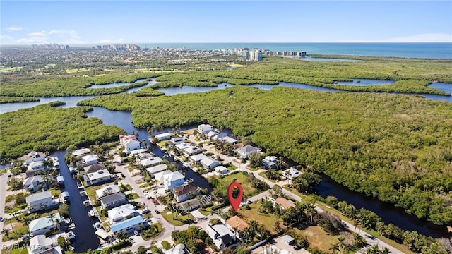 drone / aerial view with a water view