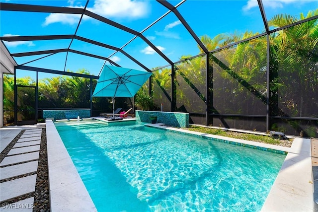 outdoor pool featuring a lanai and a patio