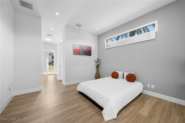 bedroom with visible vents, recessed lighting, baseboards, and light wood-style floors