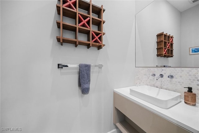 bathroom with decorative backsplash and vanity