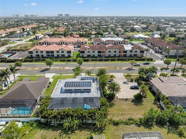 birds eye view of property with a residential view