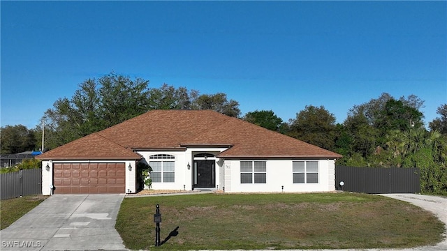 ranch-style home with a gate, fence, concrete driveway, an attached garage, and a front yard