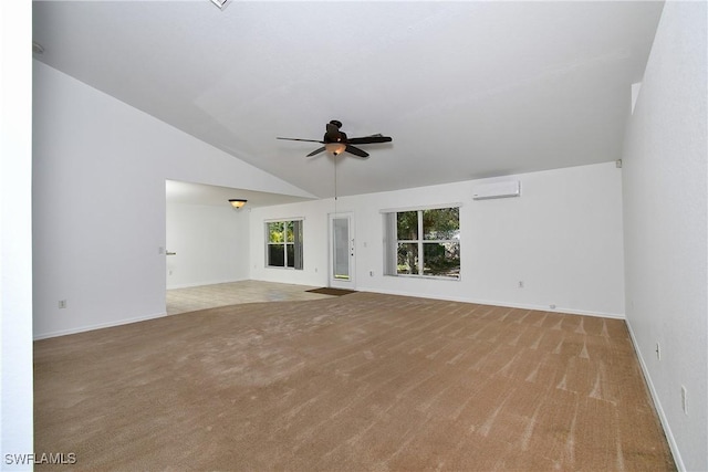 unfurnished living room featuring light colored carpet, an AC wall unit, lofted ceiling, and ceiling fan