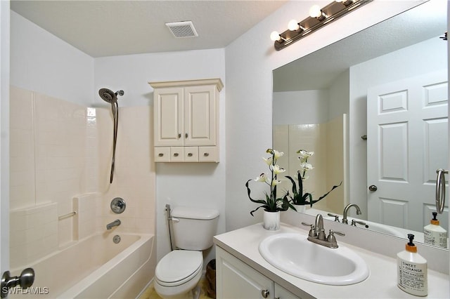 bathroom featuring vanity, toilet, visible vents, and shower / bath combination