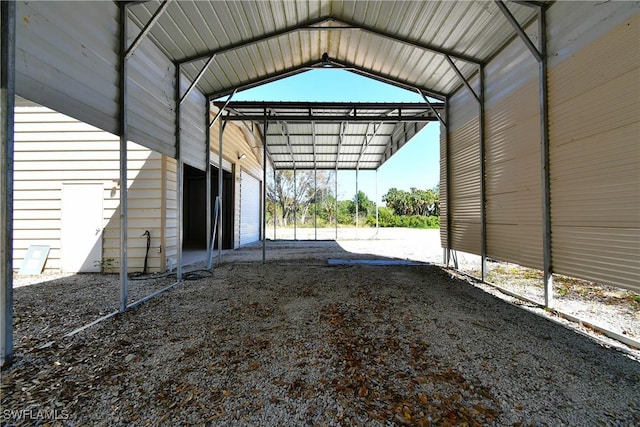 view of parking / parking lot with a detached carport