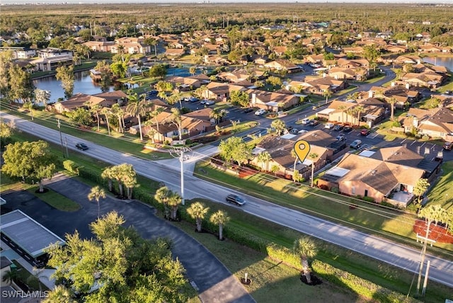 bird's eye view featuring a residential view and a water view