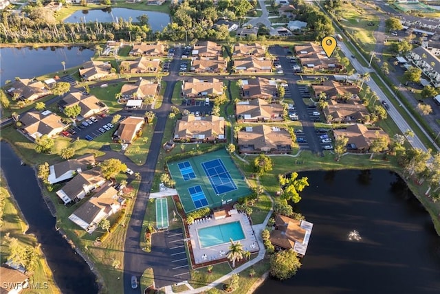 aerial view with a residential view and a water view