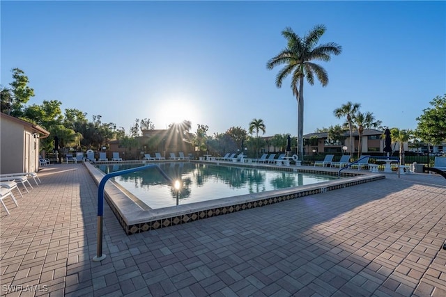 community pool with a patio area