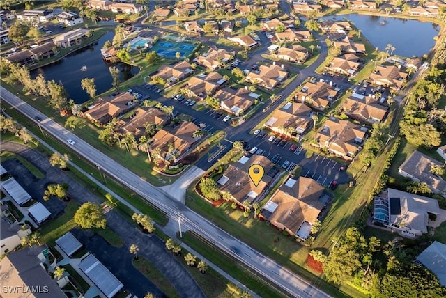 aerial view featuring a residential view and a water view