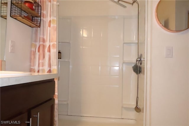 full bathroom with curtained shower and vanity