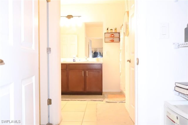 bathroom with tile patterned floors and vanity