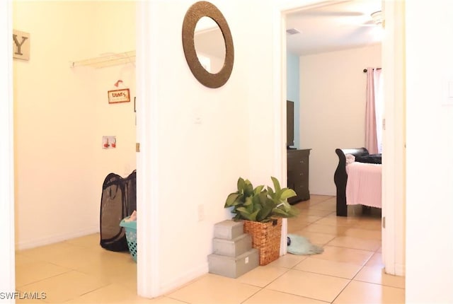 hallway with tile patterned floors and visible vents