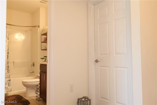 full bath with tile patterned flooring, shower / tub combo with curtain, toilet, and vanity