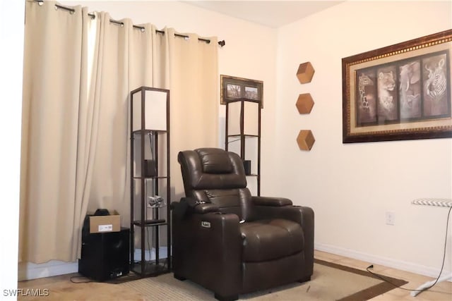 sitting room featuring baseboards