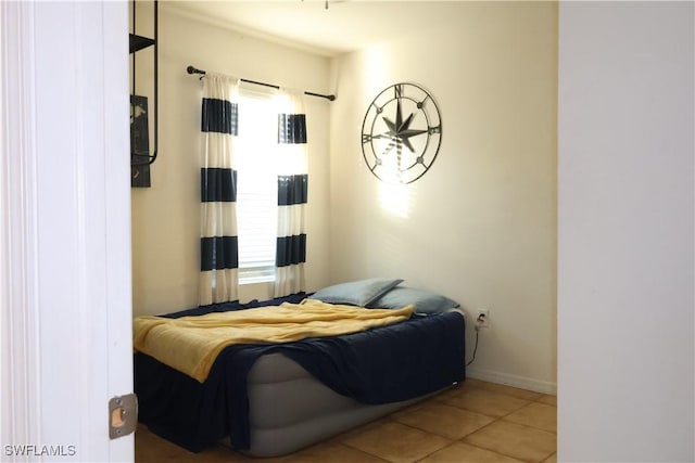 tiled bedroom with baseboards