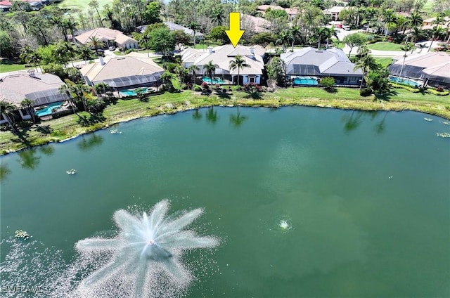 bird's eye view with a water view and a residential view