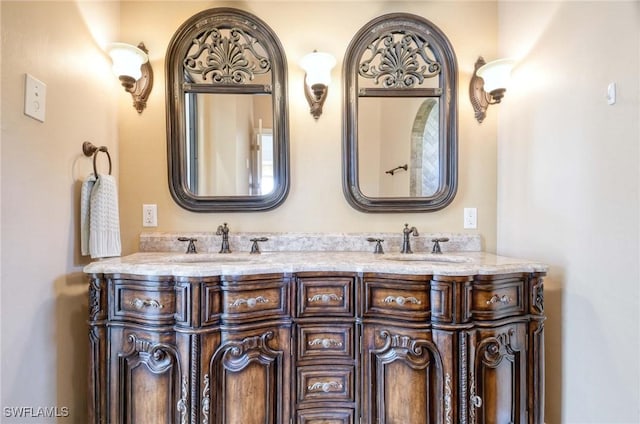 bathroom with a sink and double vanity