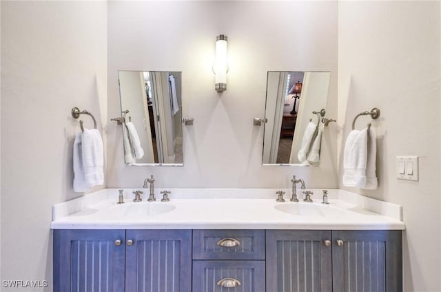 full bath featuring a sink and double vanity