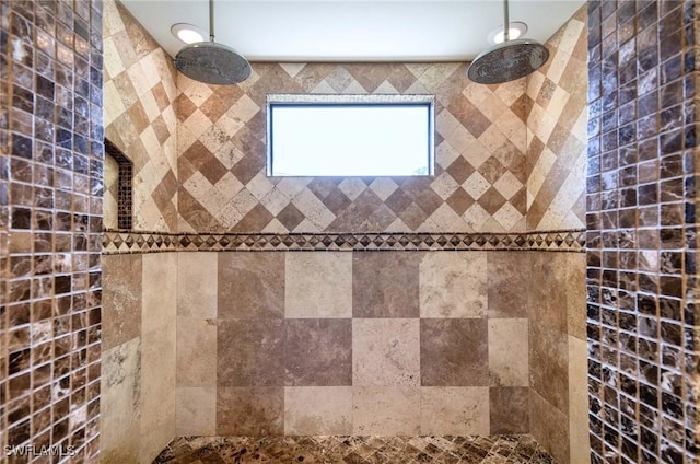 bathroom featuring a tile shower