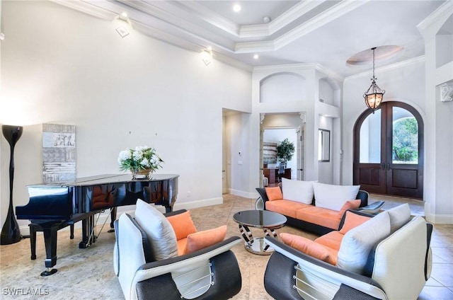 living room featuring ornamental molding, french doors, a towering ceiling, light tile patterned flooring, and arched walkways