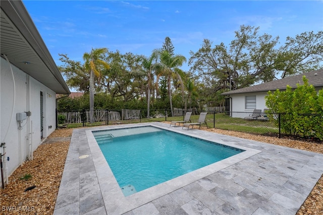 view of swimming pool with a fenced in pool, a patio, and a fenced backyard