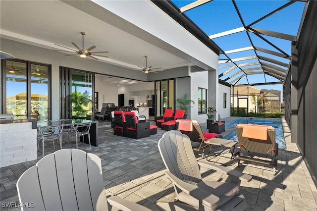 view of patio with an outdoor living space, outdoor dining area, a ceiling fan, and a lanai