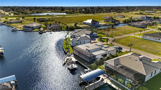 aerial view with a residential view and a water view