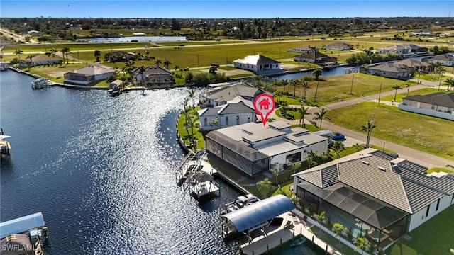 aerial view with a residential view and a water view