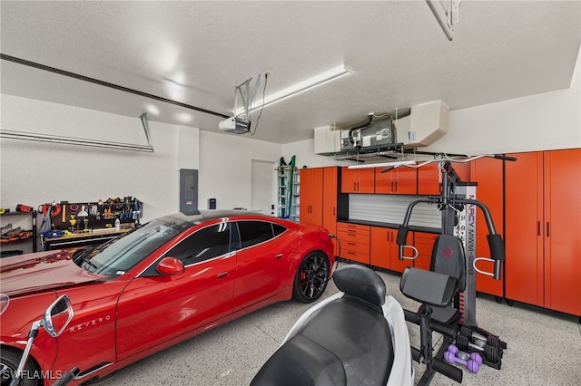 garage with electric panel and a garage door opener