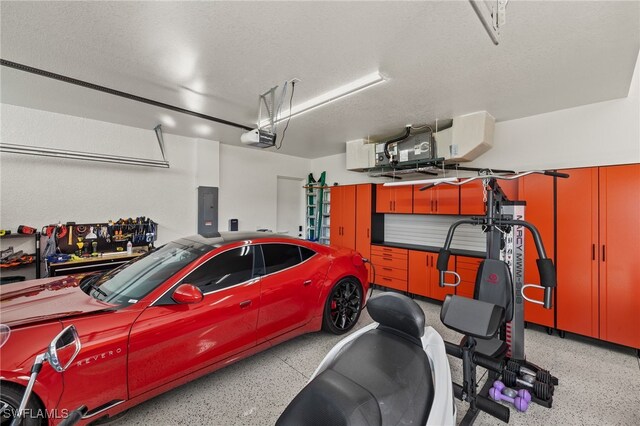 3303 NW 14th St, Cape Coral, FL 33993 - garage with electric panel and a garage door opener