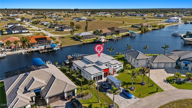 bird's eye view featuring a residential view and a water view