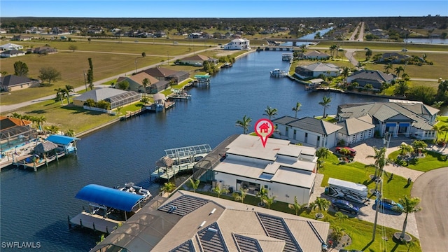 aerial view with a residential view and a water view